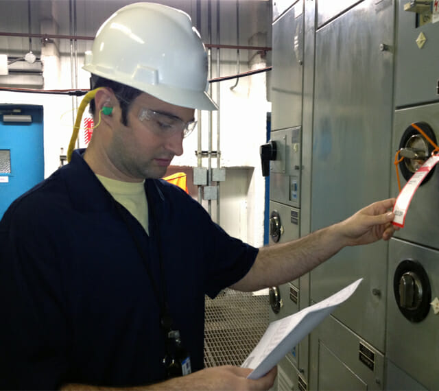 Technician Checking Asset Tag